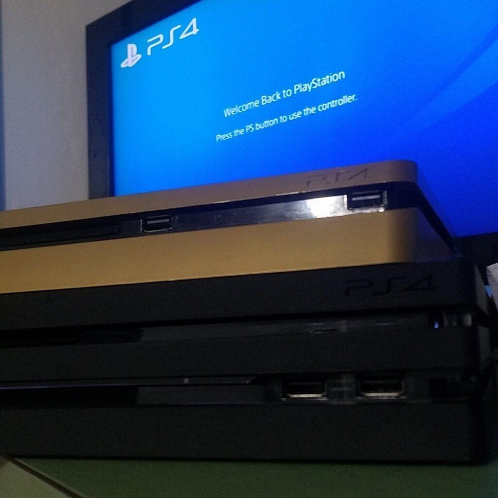 PS4 slim stacked on top of a Pro